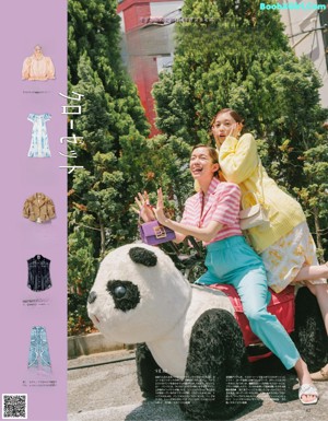 A couple of women standing next to each other on a carousel.