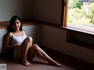 A woman sitting on the steps of a house.